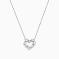 The Novelty 14K White Gold Multi Shape Diamond Heart Necklace features a heart pendant outlined with sparkling diamonds in various shapes, all set in elegant 14K white gold.