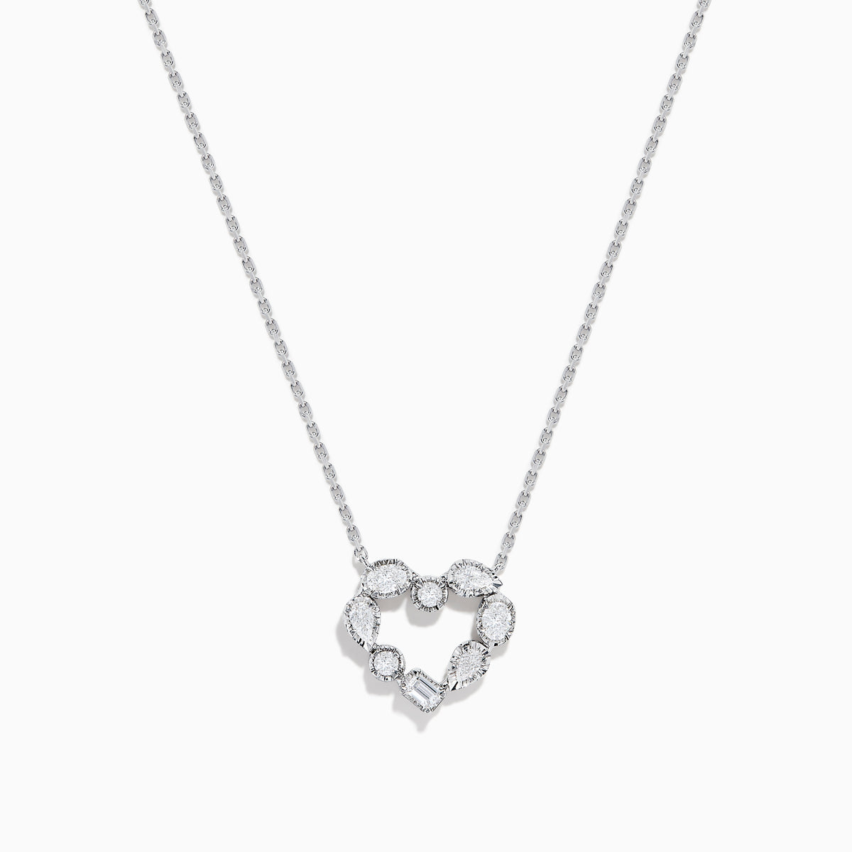 The Novelty 14K White Gold Multi Shape Diamond Heart Necklace features a heart pendant outlined with sparkling diamonds in various shapes, all set in elegant 14K white gold.