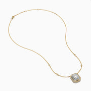 The 14K Yellow Gold Multi Shape Diamond Illusion Set Halo Pendant features a rectangular emerald-cut center with a diamond halo and a chain accented by evenly spaced round diamonds.