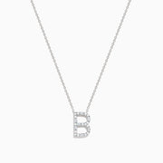 The 14K White Gold Diamond Initial B Pendant is displayed against a plain white background, featuring a delicate design with sparkling diamonds.
