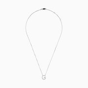 The 14K White Gold Diamond Initial G Pendant features a delicate white gold chain and a sparkling diamond-adorned G pendant, creating an elegant contrast against the plain white background.