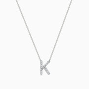 A 14 Karat White Gold Initial K Diamond Necklace featuring a sparkling diamond-encrusted K pendant on a delicate chain.