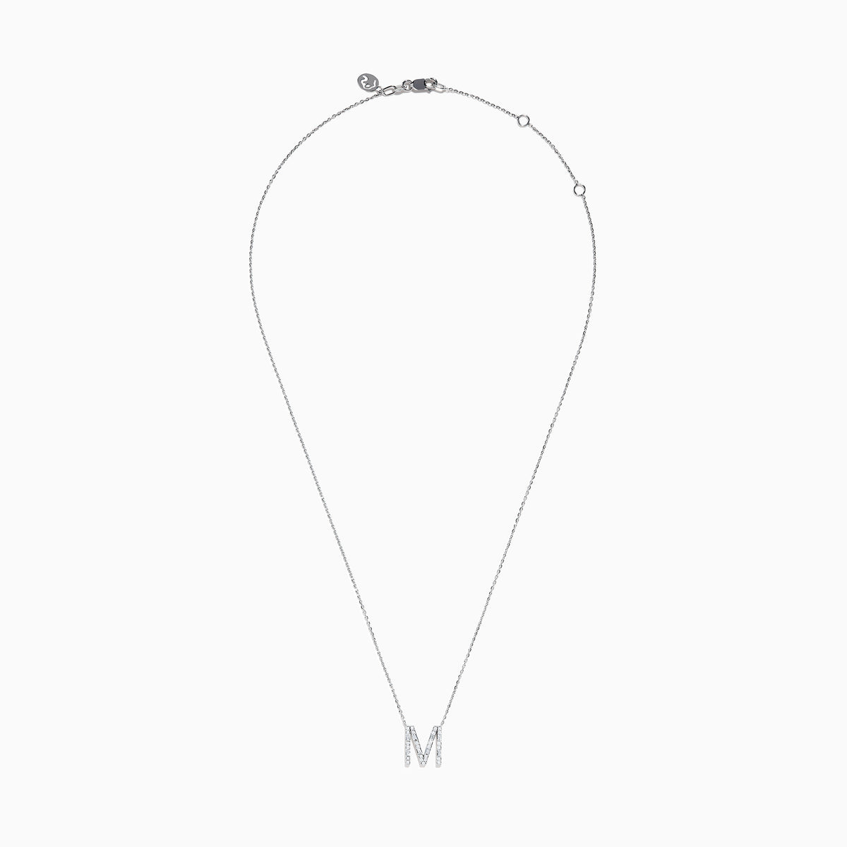 The 14K White Gold Diamond Initial M Pendant features a delicate white gold chain and a sparkling diamond-studded M pendant, displayed against a plain white background.