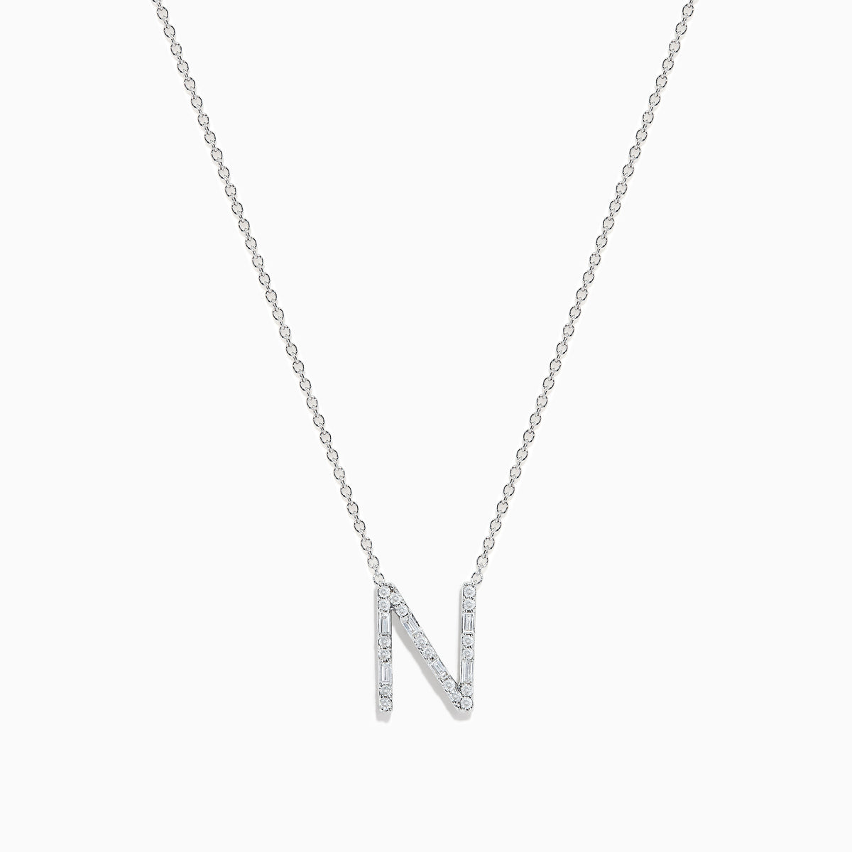 The 14K White Gold Diamond Initial N Pendant features a delicate white gold chain and a sparkling diamond-studded N, showcased on a plain white background.