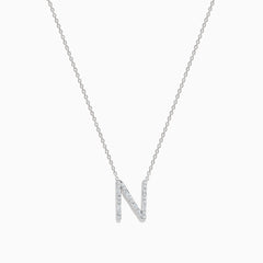 The 14K White Gold Diamond Initial N Pendant features a delicate white gold chain and a sparkling diamond-studded N, showcased on a plain white background.