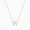 The 14K White Gold Diamond Initial W Pendant features a sparkling W adorned with diamonds, displayed on a plain white background.