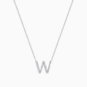 The 14K White Gold Diamond Initial W Pendant features a sparkling W adorned with diamonds, displayed on a plain white background.