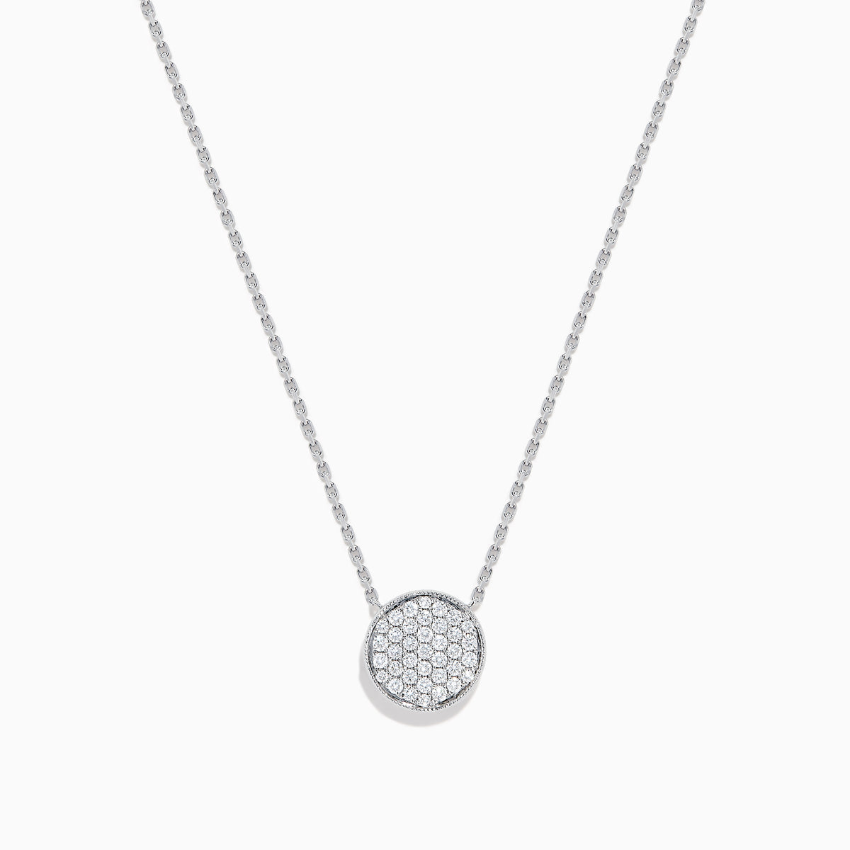 The Pave Classica 14K White Gold Diamond Disc Necklace features a round pendant encrusted with sparkling pave diamonds, elegantly displayed on a delicate white gold chain against a white background.