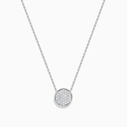 The Pave Classica 14K White Gold Diamond Disc Necklace features a round pendant encrusted with sparkling pave diamonds, elegantly displayed on a delicate white gold chain against a white background.