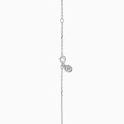 The Pave Classica 14K White Gold Diamond Disc Necklace features a round pendant encrusted with sparkling pave diamonds, elegantly displayed on a delicate white gold chain against a white background.