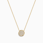 The D'Oro 14K Yellow Gold Diamond Disc Necklace features a dazzling round pendant set with sparkling diamonds, making it a stunning addition to your diamond necklace collection.