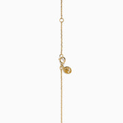 The D'Oro 14K Yellow Gold Diamond Disc Necklace features a dazzling round pendant set with sparkling diamonds, making it a stunning addition to your diamond necklace collection.