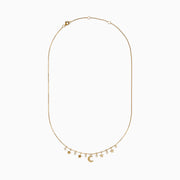 The Novelty 14K Yellow Gold Diamond Moon and Stars Necklace features five star charms, a central crescent moon, and three diamond accents on a fine gold chain, displayed against a white background.