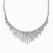 The 14K White Gold Diamond Fringe Necklace features a fan-like design with vertical bars accented by round and rectangular diamonds, creating an elegant, radiant look.