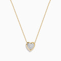 The 14K Yellow Gold Diamond Pave Heart Necklace features a delicate gold chain and a heart-shaped pendant accented with sparkling white diamonds at the center.
