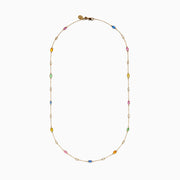The 14K Yellow Gold Multi Sapphire and Diamond Station Necklace showcases blue, pink, yellow, green, and orange oval sapphires with a diamond station, all delicately spaced along the chain.