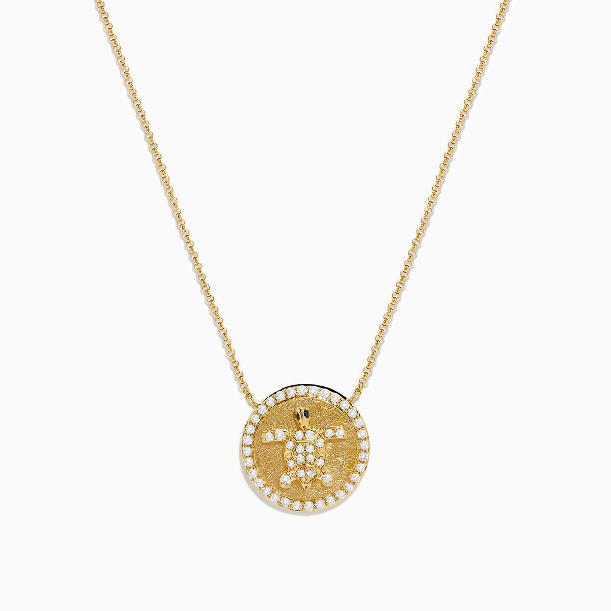 The Seaside 14K Yellow Gold White and Black Diamond Turtle Necklace features a round pendant with a turtle design outlined in sparkling white stones and an accented edge, perfect for adding everyday elegance.