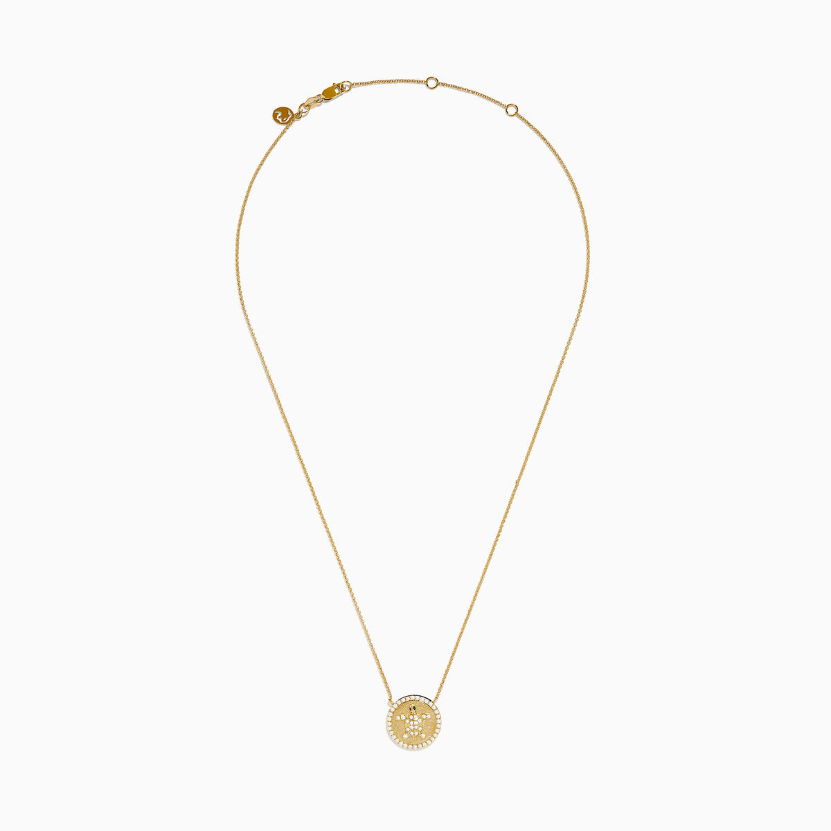 The Seaside 14K Yellow Gold White and Black Diamond Turtle Necklace features a round pendant with a turtle design outlined in sparkling white stones and an accented edge, perfect for adding everyday elegance.