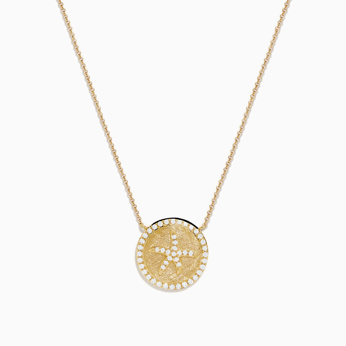 The Seaside 14K Yellow Gold Diamond Starfish Necklace showcases a round, textured pendant with a central starfish design, elegantly outlined and adorned with sparkling diamonds along the edge.