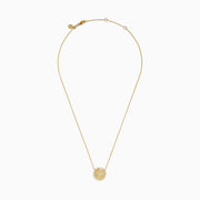 The Seaside 14K Yellow Gold Diamond Starfish Necklace showcases a round, textured pendant with a central starfish design, elegantly outlined and adorned with sparkling diamonds along the edge.