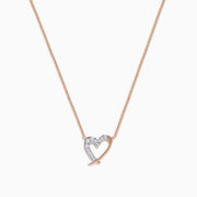 The 14K Rose Gold Diamond Open Heart Necklace features a heart-shaped pendant half encrusted with diamonds, suspended from a fine chain and displayed on a plain white background.