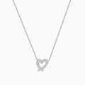 The 14K White Gold Diamond Open Heart Necklace showcases a heart-shaped pendant adorned with diamonds, elegantly suspended from a fine chain against a white background.