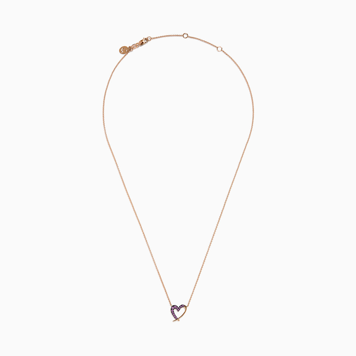 The 14K Rose Gold Pink Sapphire Open Heart Necklace features a delicate heart design, half adorned with sparkling pink sapphires, hanging gracefully from a fine chain for a romantic touch.