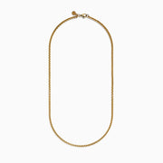 A close-up of the Mens 14K Yellow Gold Round Box Chain Necklace, 22, displayed on a white background, highlights its fine interlocking links and gentle U-shaped curve.