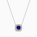 The Nahla Siri 14K Two Tone Gold Tanzanite and Diamond Necklace features a square pendant with deep blue tanzanite, framed by a double halo of sparkling diamonds in silver and gold tones.