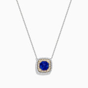 The Nahla Siri 14K Two Tone Gold Tanzanite and Diamond Necklace features a square pendant with deep blue tanzanite, framed by a double halo of sparkling diamonds in silver and gold tones.