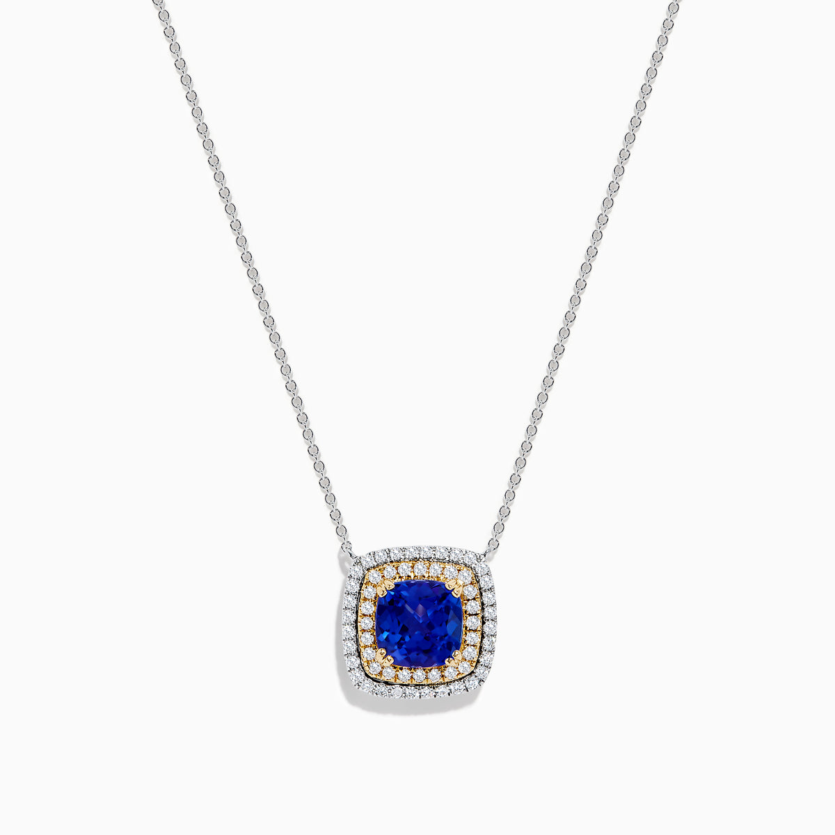 The Nahla Siri 14K Two Tone Gold Tanzanite and Diamond Necklace features a square pendant with deep blue tanzanite, framed by a double halo of sparkling diamonds in silver and gold tones.