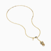 The Signature 14K Yellow Gold Diamond and Emerald Panther Necklace features a panther head pendant with diamond accents, emerald eyes, a circular ring in its mouth, an elongated link chain, and a small charm near the clasp.