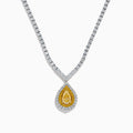 The 18K Two-Tone Gold Yellow and White Diamond Double Halo Necklace features a teardrop-shaped yellow gemstone pendant with a double halo of diamonds, hanging from a white diamond-set chain.