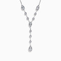 The 14K White Gold Bezel-Set Diamond Lariat Necklace showcases round and teardrop bezel-set diamonds in a Y-shaped design, all gracefully suspended from a delicate chain.