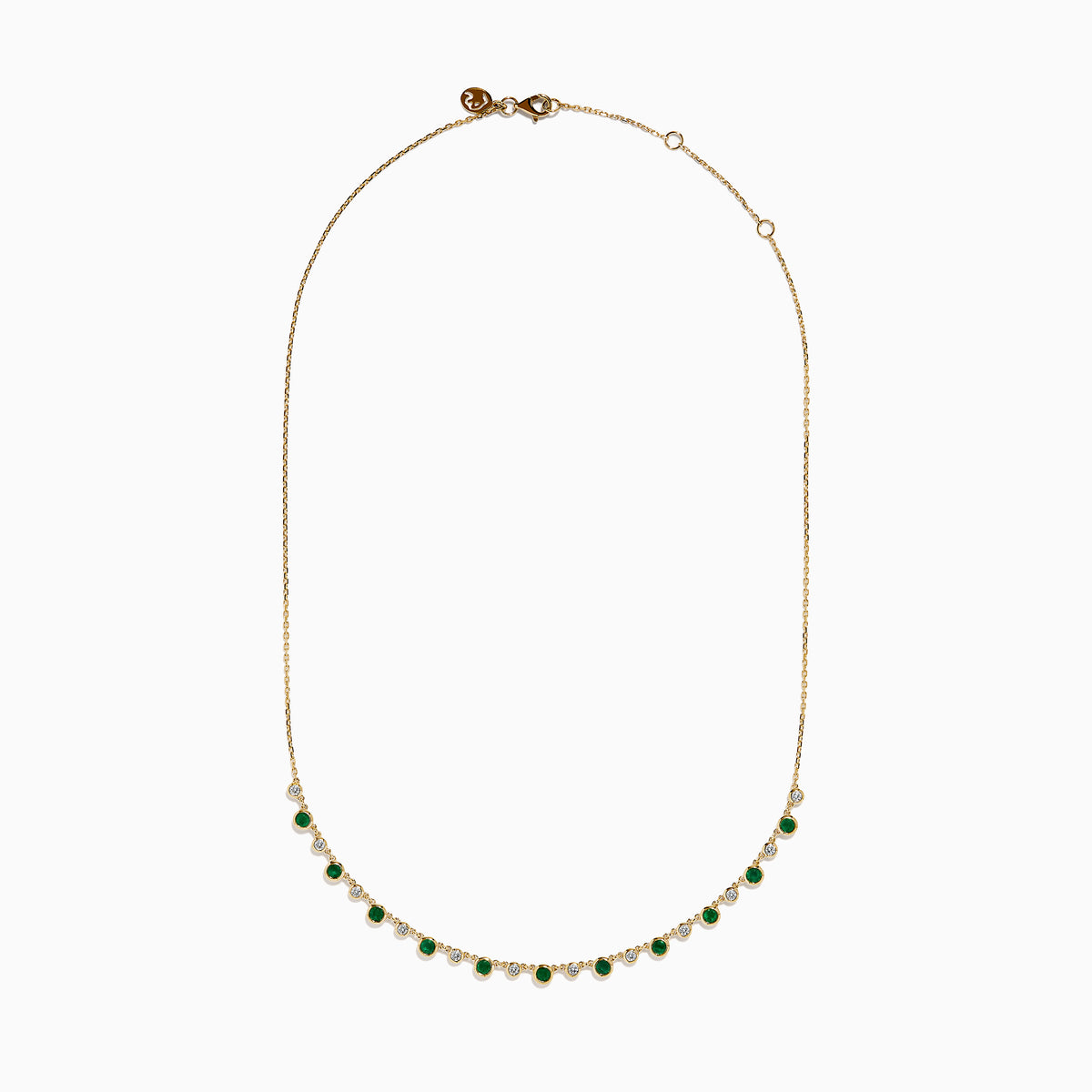 The 14K Yellow Gold Emerald and Diamond Bezel Set Station Necklace features alternating round emeralds and diamonds in bezel settings, evenly spaced along the front curve of the chain, displayed on a white background.