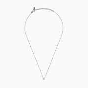 The 14K Two Tone Gold Diamond Solitaire Necklace features a single round-cut diamond in a classic prong setting, elegantly displayed at the center of a fine two-tone gold chain.