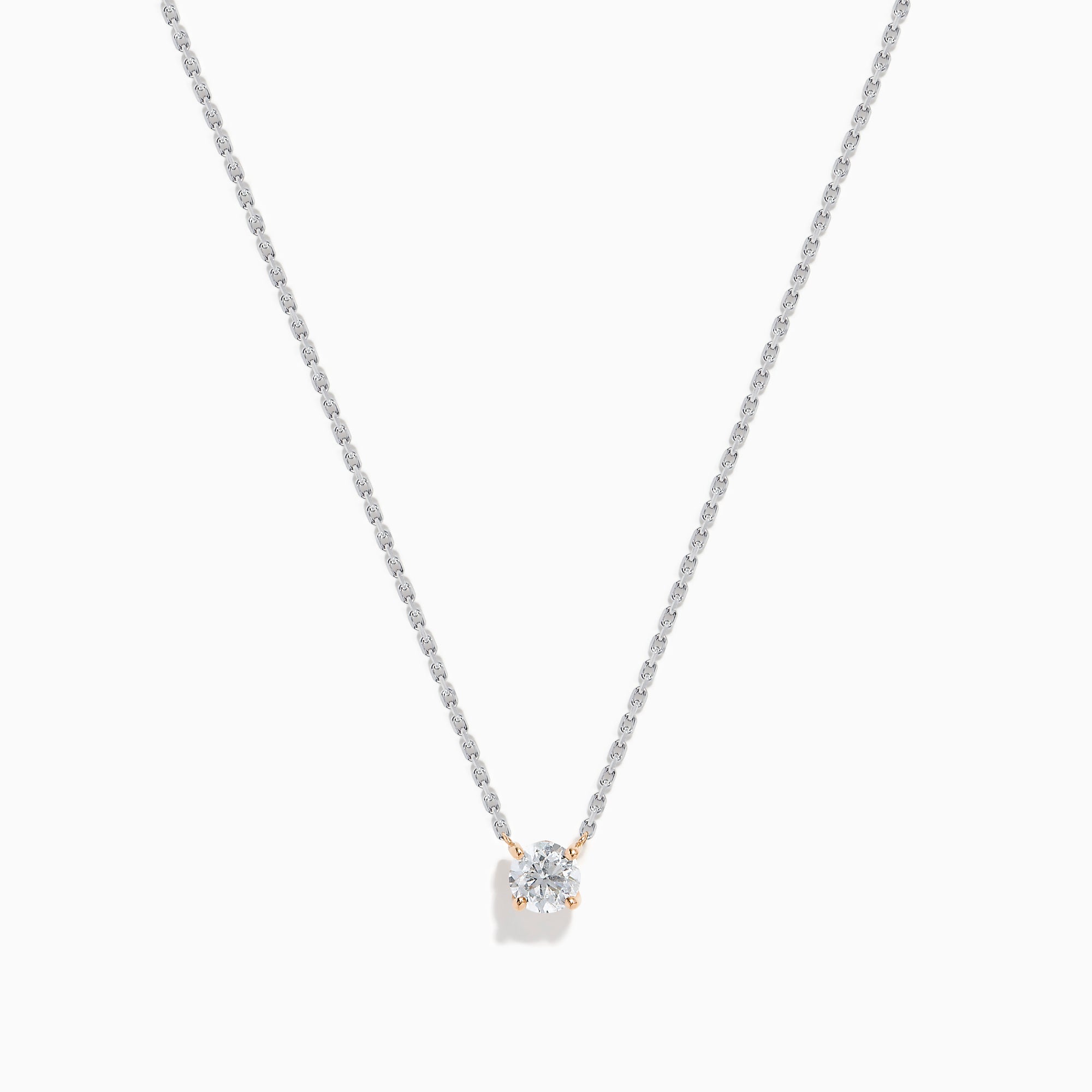 The 14K Two Tone Gold Diamond Solitaire Necklace features a single round-cut diamond in a classic prong setting, elegantly displayed at the center of a fine two-tone gold chain.