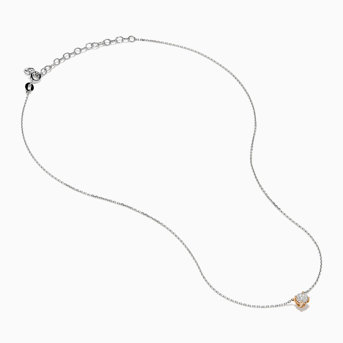 The 14K Two Tone Gold Diamond Solitaire Necklace features a single round-cut diamond in a classic prong setting, elegantly displayed at the center of a fine two-tone gold chain.
