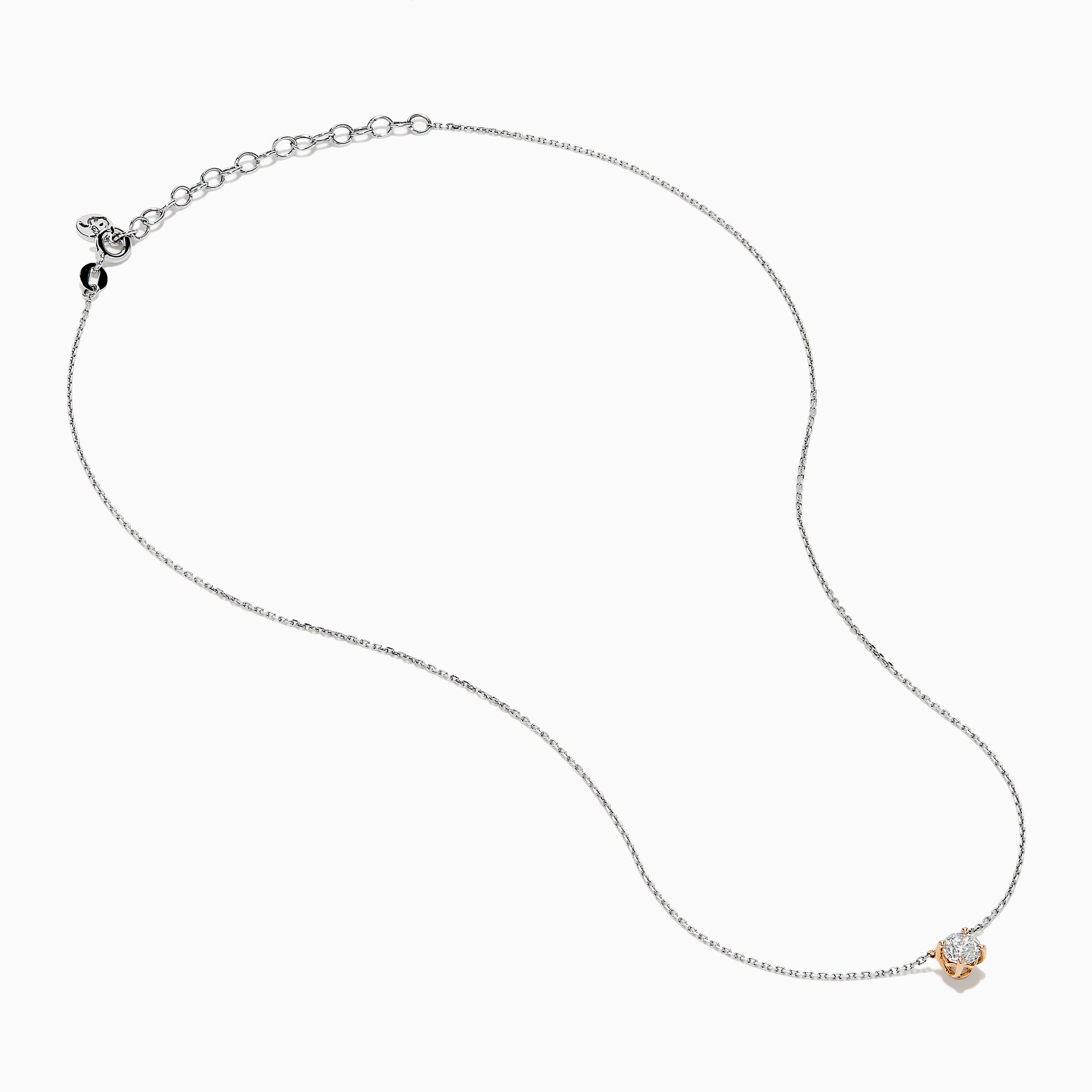 The 14K Two Tone Gold Diamond Solitaire Necklace features a single round-cut diamond in a classic prong setting, elegantly displayed at the center of a fine two-tone gold chain.