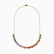 The 14K Yellow Gold Multi Sapphire and Diamond Collar Necklace showcases a curved row of white diamonds with green, blue, pink, orange, and yellow sapphires hanging below in a vibrant gradient design.
