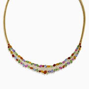 The Watercolors 14K Yellow Gold Multi Sapphire and Diamond Necklace features a geometric front design with vibrant green, blue, red, pink, and orange sapphires accented by diamonds.