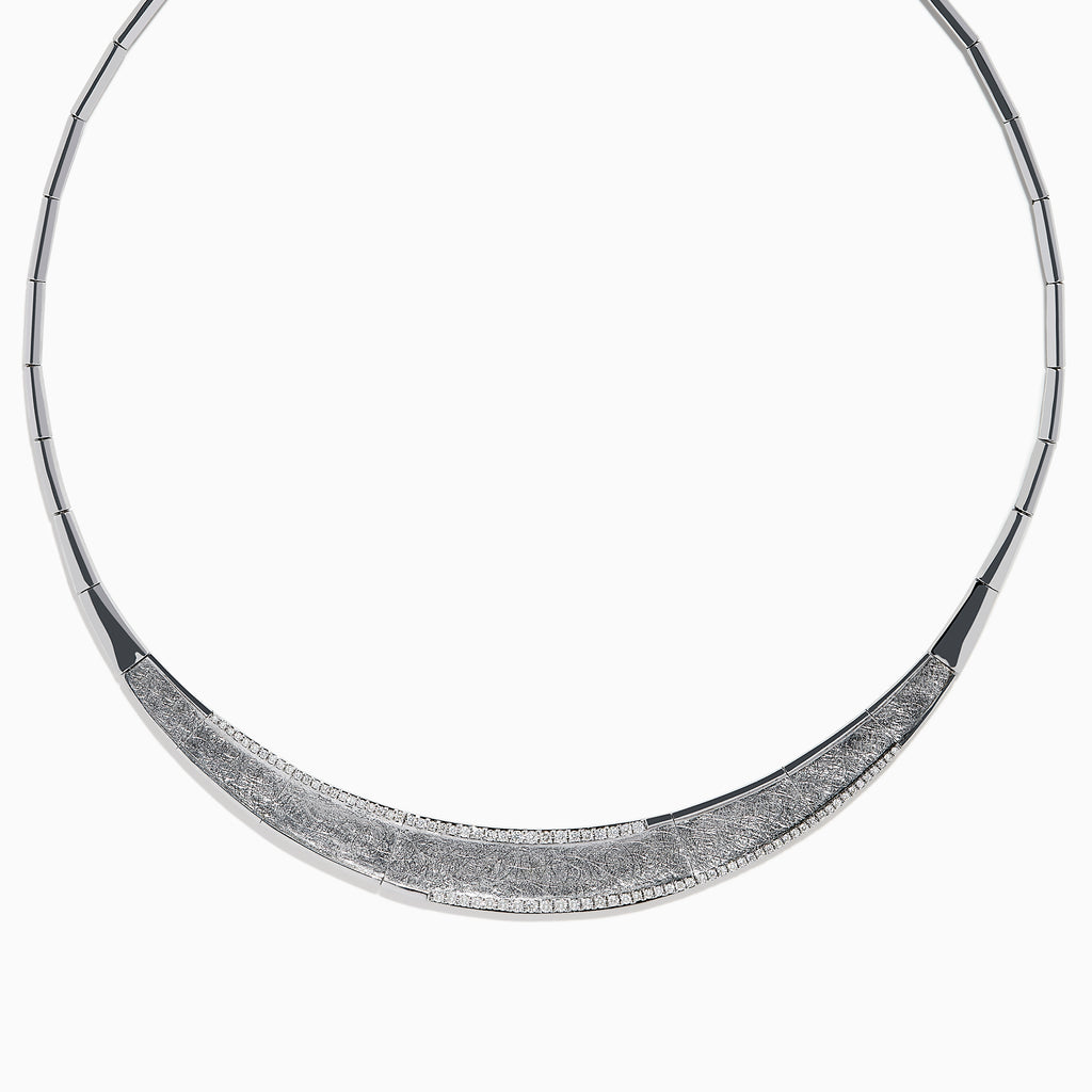 The 925 Sterling Silver Diamond Accented Necklace is a modern, elegant piece with a textured, curved front and sparkling stones on a sleek segmented band.