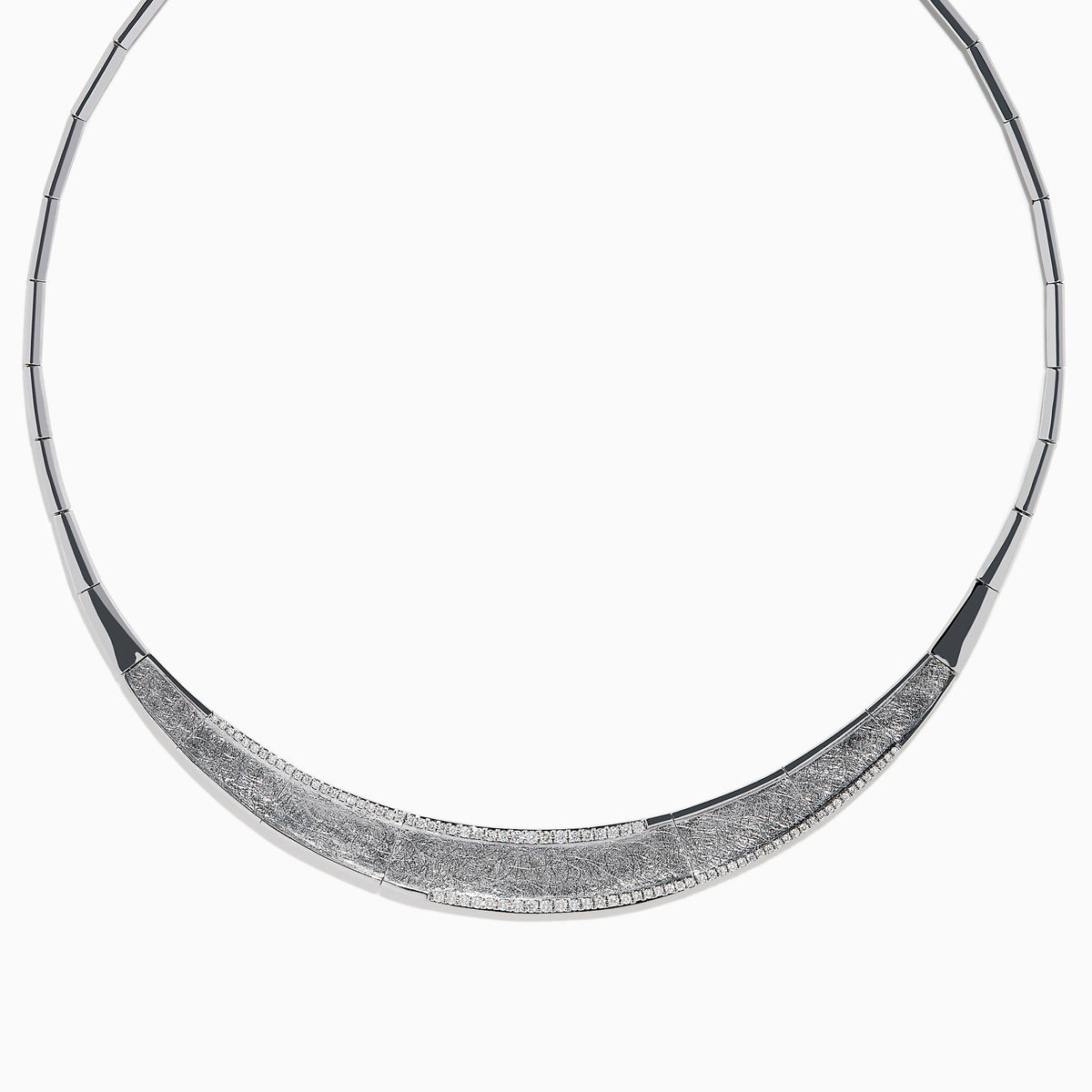 The 925 Sterling Silver Diamond Accented Necklace is a modern, elegant piece with a textured, curved front and sparkling stones on a sleek segmented band.
