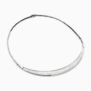 The 925 Sterling Silver Diamond Accented Necklace is a modern, elegant piece with a textured, curved front and sparkling stones on a sleek segmented band.