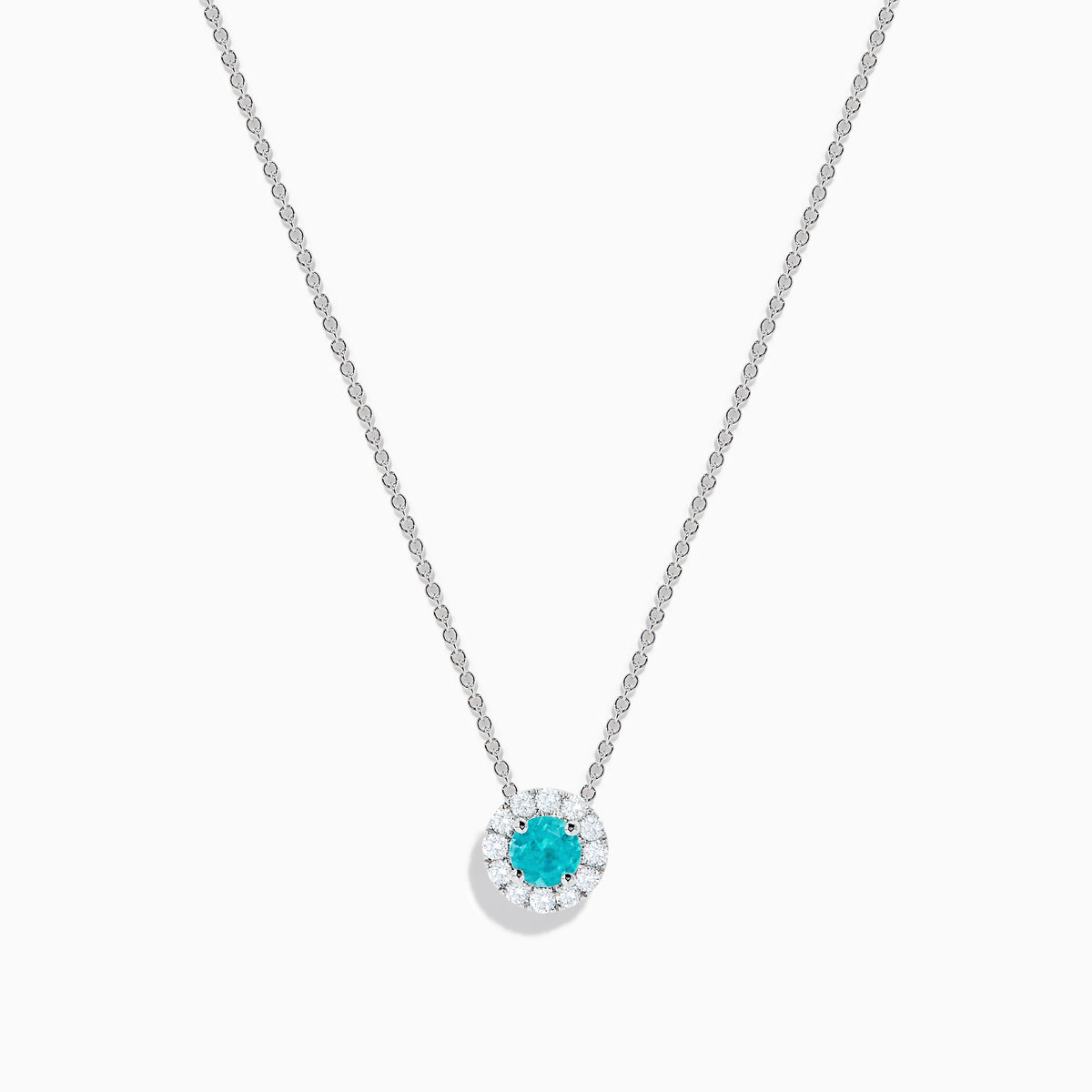 The 18K White Gold Paraiba and Diamond Pendant features a round Paraiba gemstone framed by a halo of white diamonds, elegantly suspended from a fine chain on a white background.