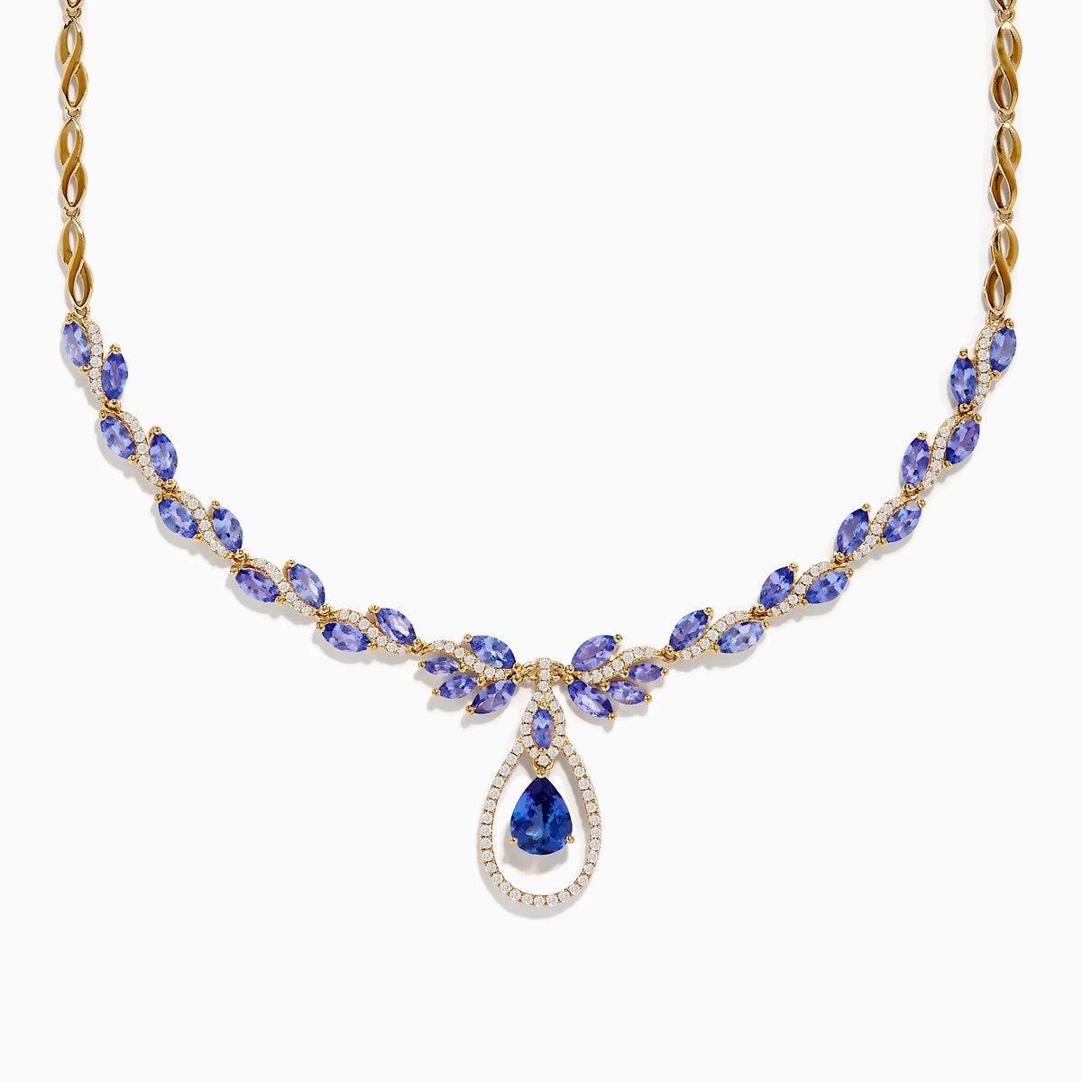 The Nahla Siri 14K Yellow Gold Tanzanite and Diamond Necklace features marquise-cut blue tanzanite gemstones and small diamonds, with a teardrop-shaped tanzanite pendant encircled by a sparkling diamond halo.