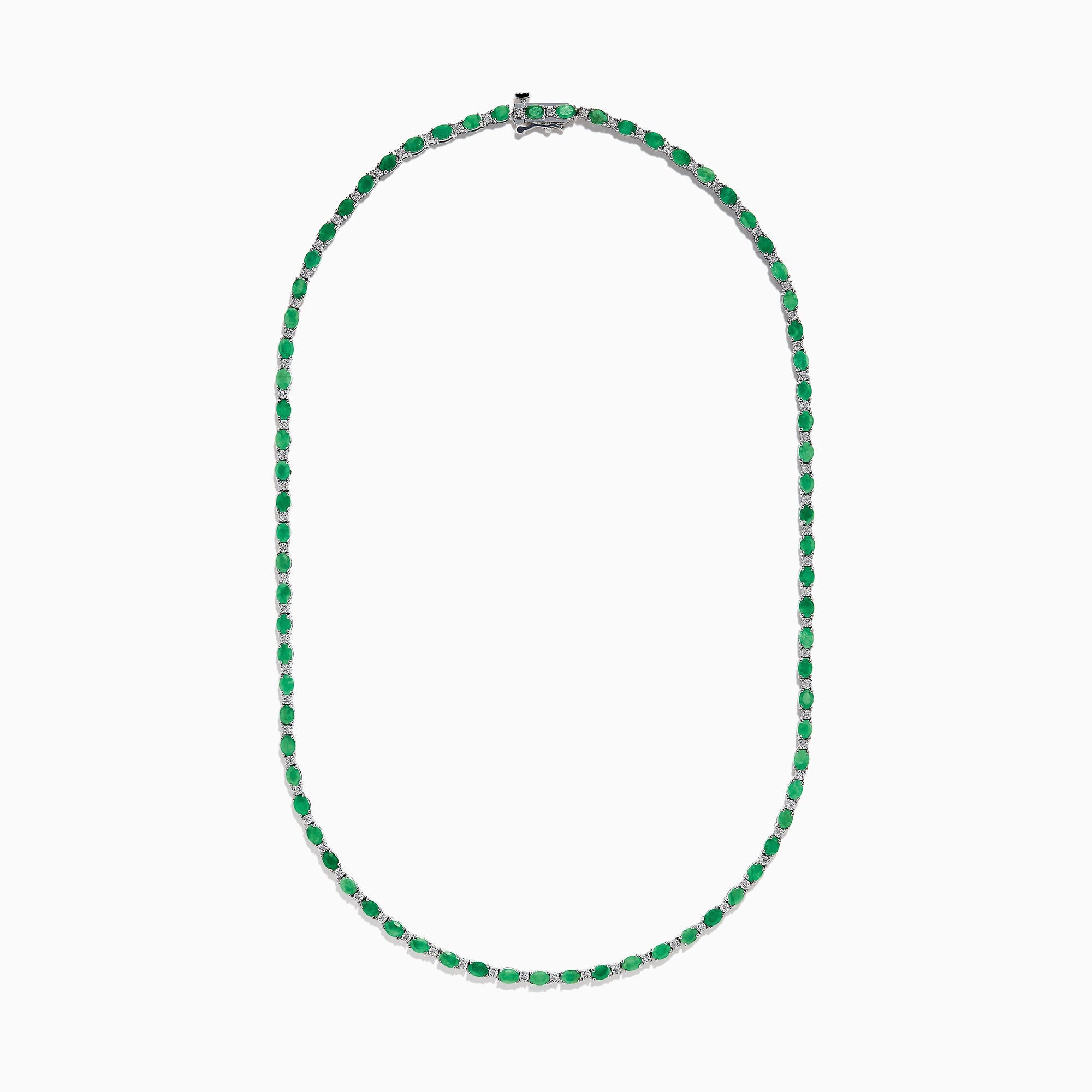 The 925 Sterling Silver Emerald and Diamond Tennis Necklace showcases a sleek row of oval green emeralds and sparkling diamonds set in sterling silver, beautifully arranged against a crisp white background.