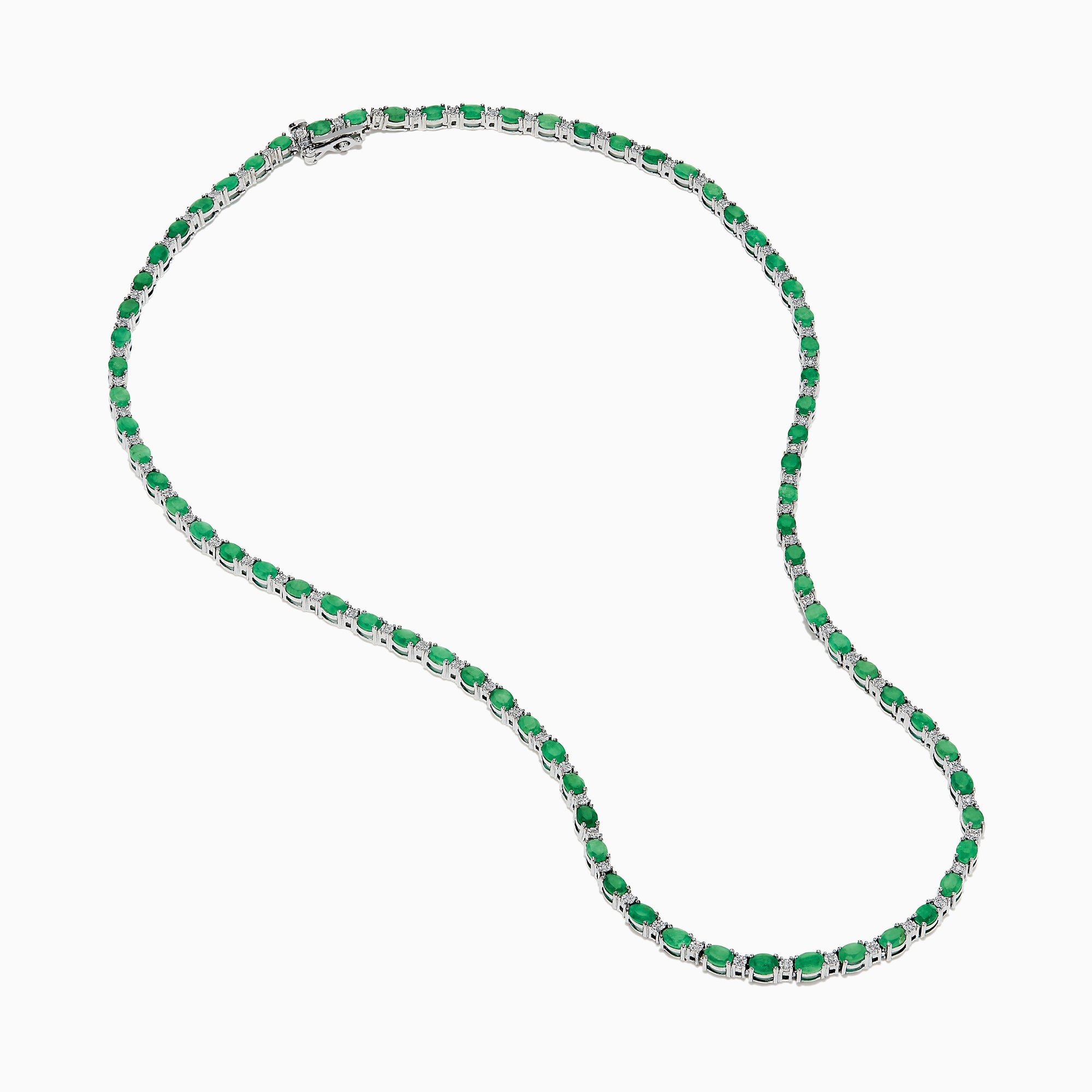 The 925 Sterling Silver Emerald and Diamond Tennis Necklace showcases a sleek row of oval green emeralds and sparkling diamonds set in sterling silver, beautifully arranged against a crisp white background.
