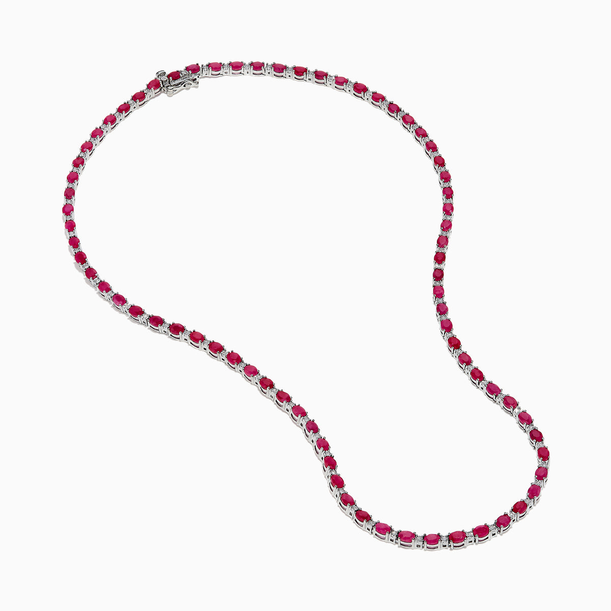 The 925 Sterling Silver Ruby and Diamond Tennis Necklace showcases a continuous row of oval red gemstones in silver prong settings, elegantly displayed against a white background.