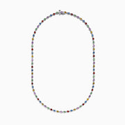 The 925 Sterling Silver Diamond and Multi Sapphire Tennis Necklace features evenly spaced blue, green, red, yellow, and purple gemstones along the chain, creating a vibrant sapphire-inspired design.